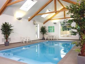 a swimming pool in a house with a roof at Holiday Home The Valley by Interhome in Perranwell