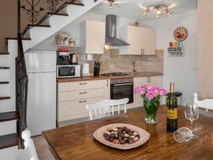 a kitchen with a table with a plate of food on it at Holiday Home Villa Aurora by Interhome in Loborika