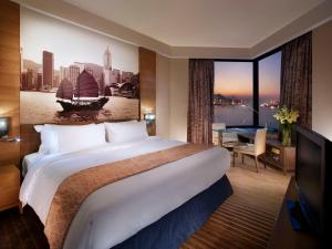 Uma cama ou camas num quarto em Harbour Grand Hong Kong