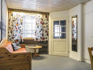 a room with a bed and a window and a door at Holiday Home Revontuli 2 by Interhome in Syöte
