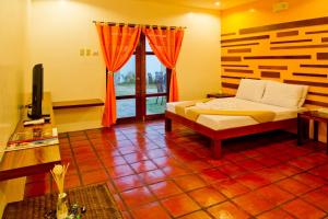 Posteľ alebo postele v izbe v ubytovaní Acacia Tree Garden Hotel