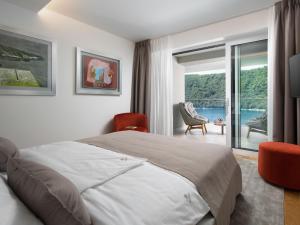 Posteľ alebo postele v izbe v ubytovaní Villa Vlastelini II by Interhome