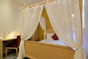 Postel nebo postele na pokoji v ubytování In Young Hotel