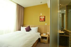 Postel nebo postele na pokoji v ubytování In Young Hotel