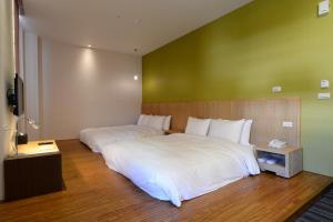 Postel nebo postele na pokoji v ubytování In Young Hotel