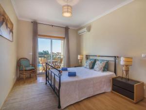 a bedroom with a bed and a balcony at Apartment Monte da Eira by Interhome in Brejos