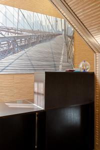 a kitchen with a view of a wooden bridge at Mini Hotel na Nevskom 136 in Saint Petersburg
