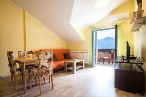 a living room with a couch and a table at Apartments Radonjić in Kotor