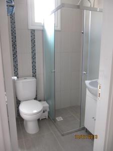 a bathroom with a toilet and a sink at Sunny Holiday Apartments in Protaras
