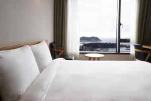 Postel nebo postele na pokoji v ubytování Mstay Hotel