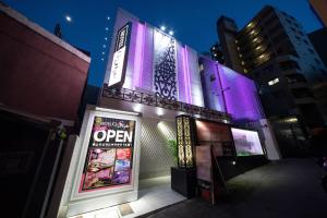 a store with purple lights on the side of a building at Hotel G-Style (Adult Only) in Tokyo