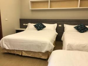 Rúm í herbergi á Good Nest Homestay