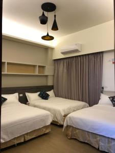 Postel nebo postele na pokoji v ubytování Good Nest Homestay