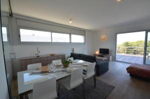 a kitchen and living room with a table and chairs at Bellavista - Ref. 029 in Begur
