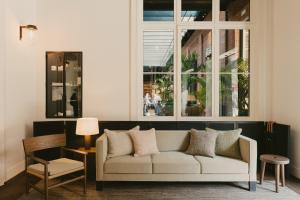 a living room with a couch and a window at august in Antwerp