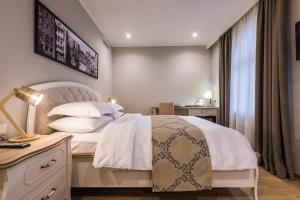 Postel nebo postele na pokoji v ubytování Hotel Khokhobi Old Tbilisi