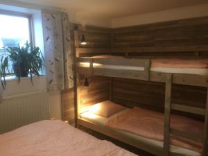 two bunk beds in a room with a window at Kungshamns Vandrarhem in Kungshamn +28 photos
