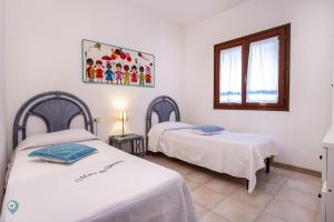 Postel nebo postele na pokoji v ubytování Villino Funtana