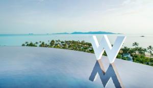 an infinity pool with a view of the ocean at W Koh Samui in Mae Nam
