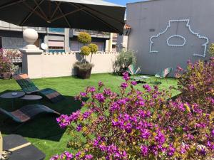 A garden outside 200 ROOMS & TERRACE