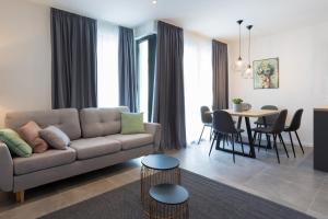 a living room with a couch and a table at Apartments Jadranka in Selce