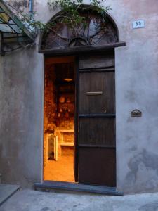 a door leading into a store with a window at Soqquadro Art&Relax Alassio - Romantico Frantoio 1600 in Alassio