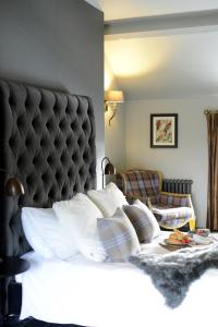Postel nebo postele na pokoji v ubytování Cotswold Grey