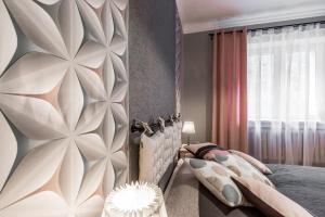 Łóżko lub łóżka w pokoju w obiekcie Apartament Bulwary Zakopane