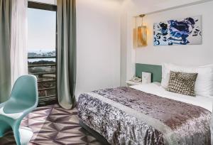 Postel nebo postele na pokoji v ubytování Hotel Luxe