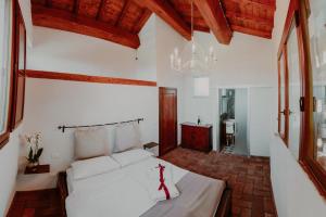 Un pat sau paturi într-o cameră la SommaVilla B&B