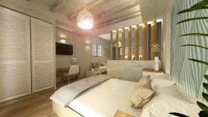 A bed or beds in a room at Aeolia suites