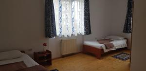Postel nebo postele na pokoji v ubytování Coroian House