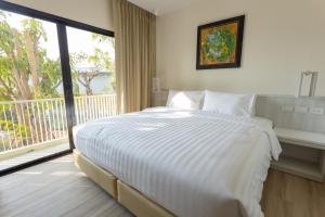 Porestva Hotel Sriracha客房内的一张或多张床位