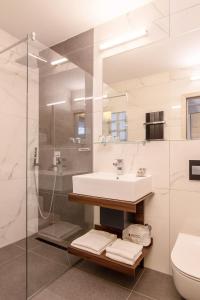 a bathroom with a sink and a shower at Dependences - San Simon Resort in Izola +21 photos