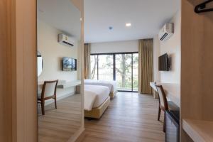 Porestva Hotel Sriracha客房内的一张或多张床位
