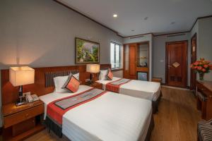 Voodi või voodid majutusasutuse Hanoi Larosa Hotel toas
