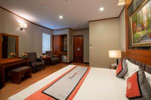 Voodi või voodid majutusasutuse Hanoi Larosa Hotel toas