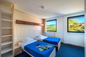 Кровать или кровати в номере Hostel - Le Mittel