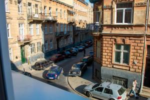a group of cars parked on a city street at Antique Lviv in Lviv