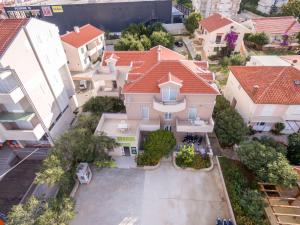 an overhead view of a house with red roofs at Apartments Karolina in Novalja