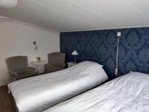 Postel nebo postele na pokoji v ubytování B&B De Blauwe Tulp