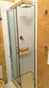 a shower with a glass door in a bathroom at Ravello View in Scala +24 photos