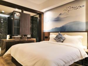 Krevet ili kreveti u jedinici u okviru objekta Paco Hotel Tiyuxilu Metro Guangzhou-Free Shuttle Bus during Canton Fair