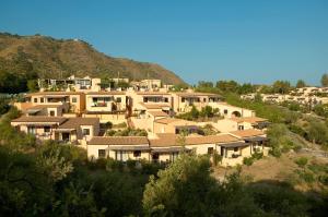 a row of houses on top of a hill at Hapimag Resort Cefalù in Cefalù