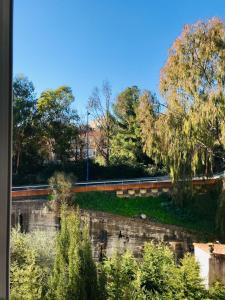 a view of a park with trees and a road at Appartement PALOMA Proche Cannes in Le Cannet