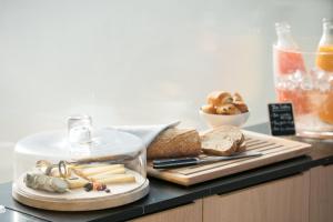 a tray of cheese and bread on a counter at Les Bords De Mer in Marseille