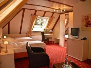 Ένα ή περισσότερα κρεβάτια σε δωμάτιο στο Land-gut-Hotel Restaurant Kreuz Meyer
