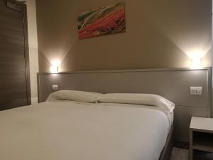 Posteľ alebo postele v izbe v ubytovaní Hotel & Wellness Stella Delle Langhe