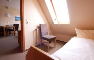 Postel nebo postele na pokoji v ubytování Juist Ferienwohnung 304 Strandburg