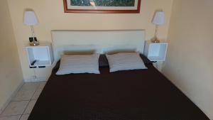Postel nebo postele na pokoji v ubytování Guest House Brezza Marina